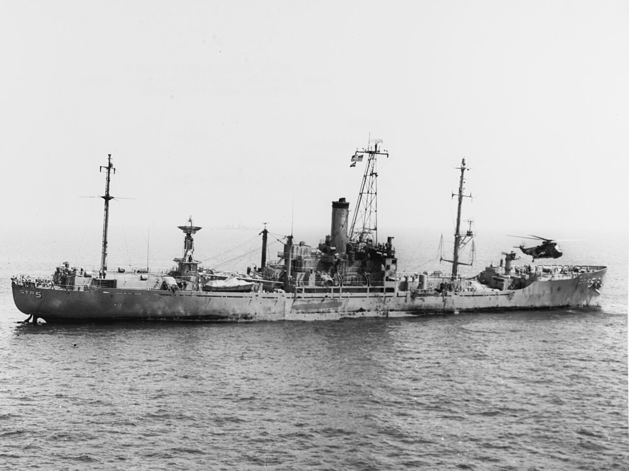 The June — SH-3A Sea King hovers over the damaged USS Liberty (AGTR-5) on 8 June 1967 (USN 1123118)